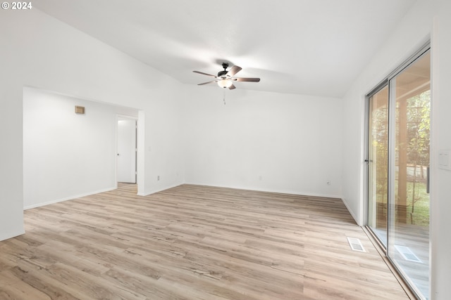 empty room with light hardwood / wood-style floors, lofted ceiling, and ceiling fan