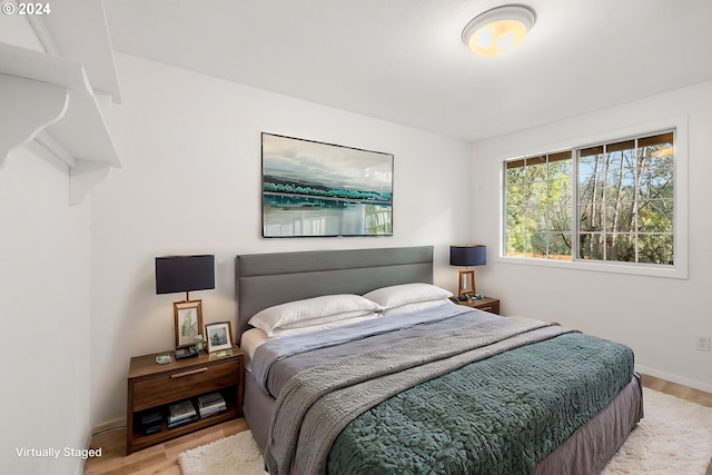 bedroom featuring wood-type flooring