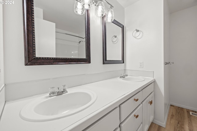 bathroom featuring vanity and wood-type flooring