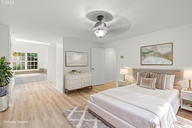 bedroom featuring ceiling fan and light hardwood / wood-style floors