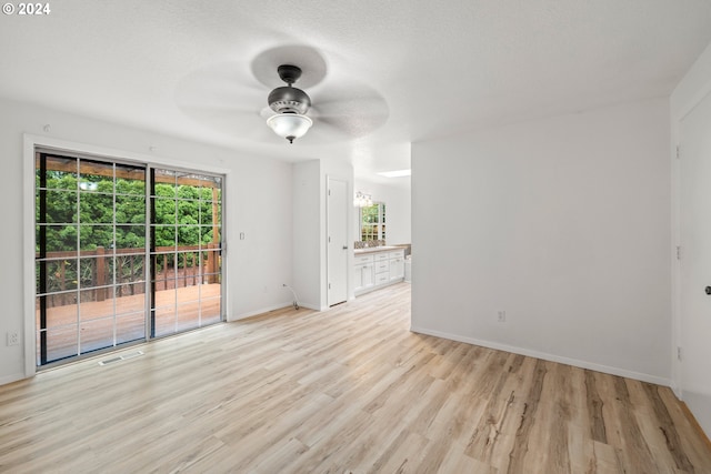 unfurnished room featuring ceiling fan and light hardwood / wood-style flooring