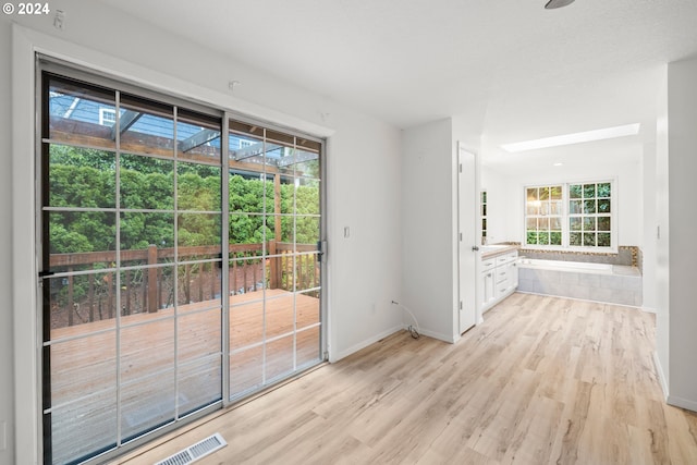 entryway with light hardwood / wood-style flooring