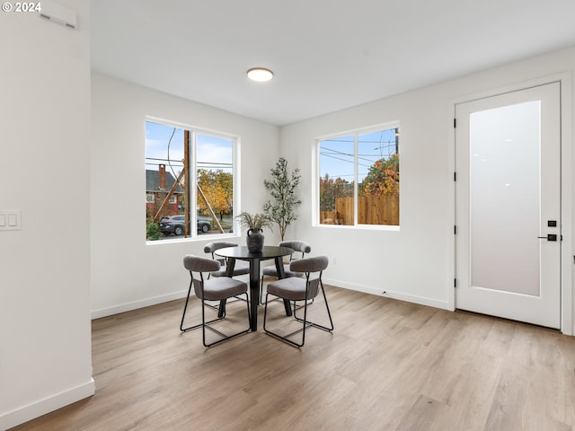 dining area with light wood-type flooring