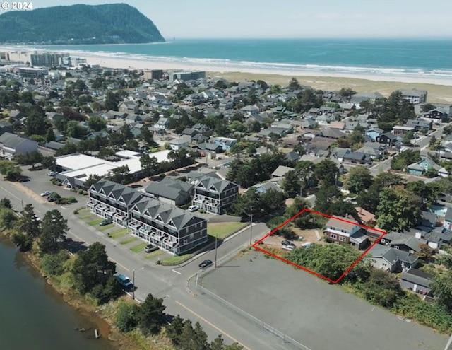 bird's eye view featuring a beach view and a water view