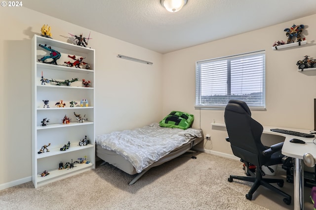 carpeted bedroom with a textured ceiling