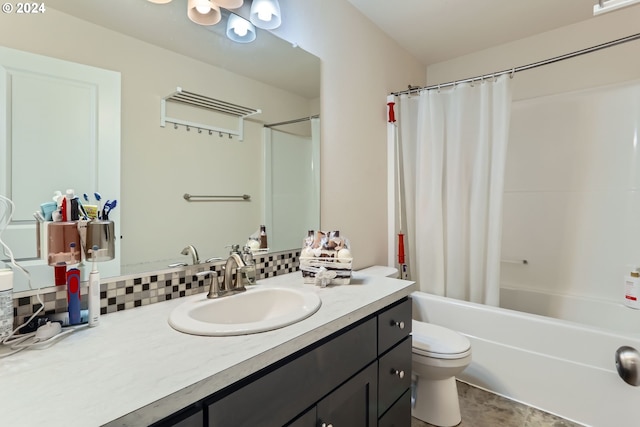 full bathroom featuring tasteful backsplash, vanity, shower / tub combo, and toilet