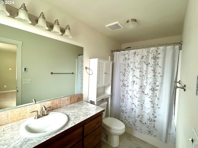 bathroom featuring toilet, visible vents, shower / bath combo with shower curtain, and vanity