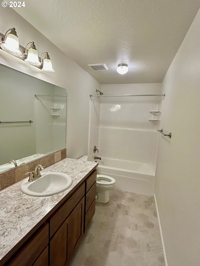 full bath featuring a textured ceiling, toilet, bathing tub / shower combination, vanity, and visible vents