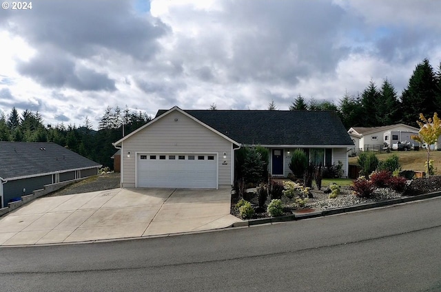 ranch-style house featuring a garage and driveway