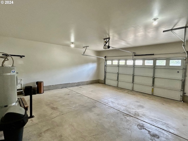 garage with baseboards and a garage door opener