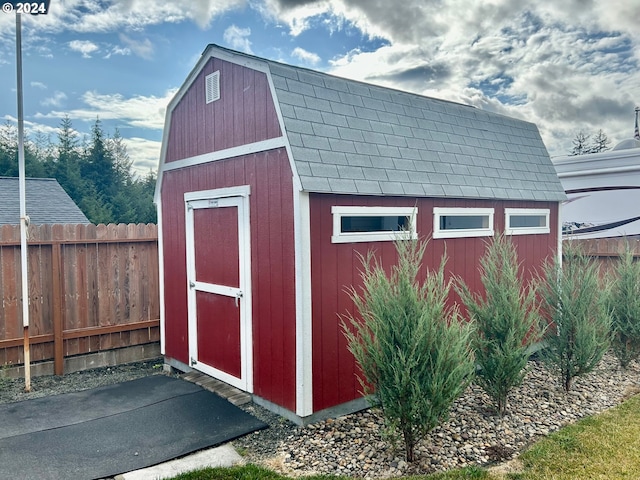 view of shed with fence