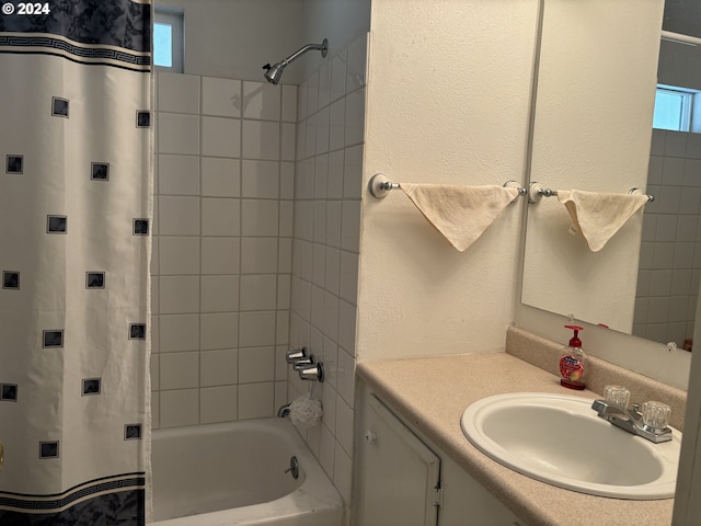 bathroom featuring vanity and shower / bath combo with shower curtain