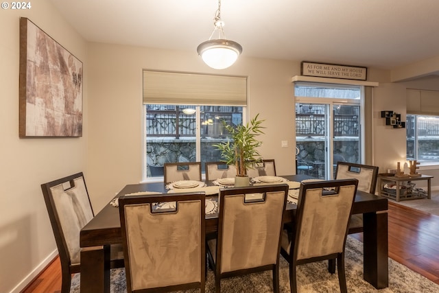 dining area with dark wood-type flooring