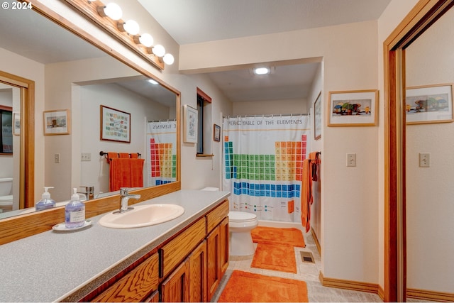 bathroom featuring toilet, tile patterned flooring, walk in shower, and vanity