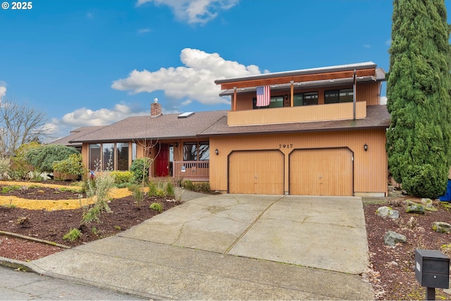 view of front of property with a garage and covered porch