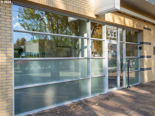 doorway to property with a patio area