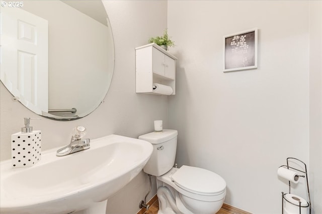 bathroom with sink and toilet