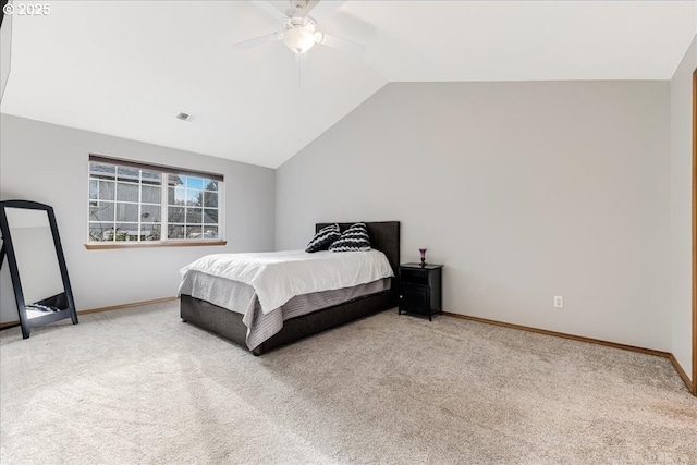 bedroom featuring carpet floors, ceiling fan, and lofted ceiling