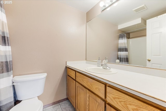 bathroom with tile patterned floors, vanity, a shower with shower curtain, and toilet