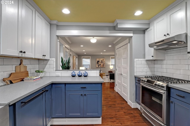 kitchen featuring stainless steel gas range oven, white cabinetry, kitchen peninsula, and blue cabinets