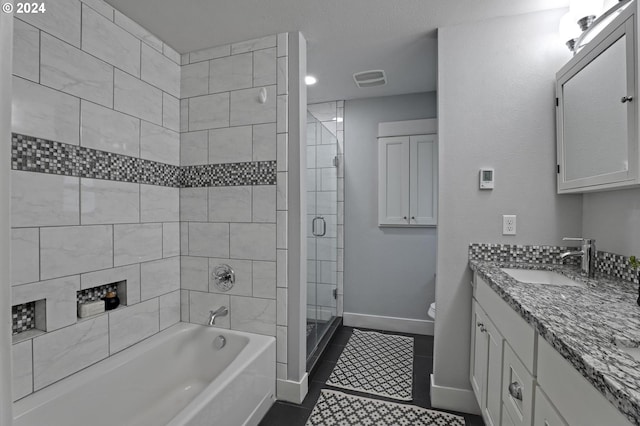 full bathroom with plus walk in shower, vanity, tile patterned flooring, and toilet