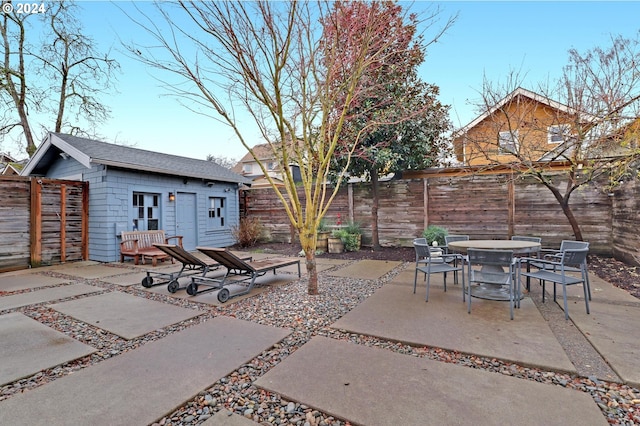 view of patio / terrace featuring an outbuilding