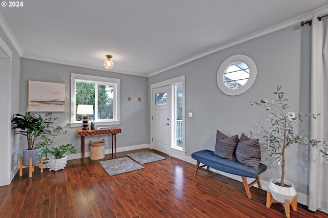 entrance foyer with dark hardwood / wood-style flooring and ornamental molding