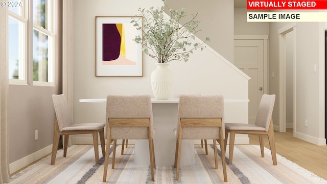 dining space featuring hardwood / wood-style floors