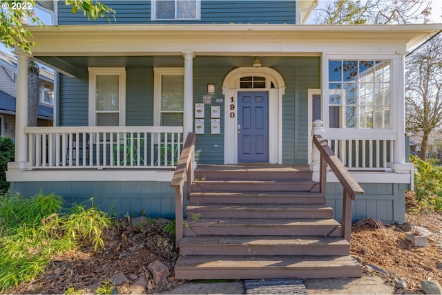 property entrance featuring covered porch