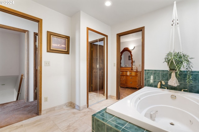 bathroom featuring a relaxing tiled tub