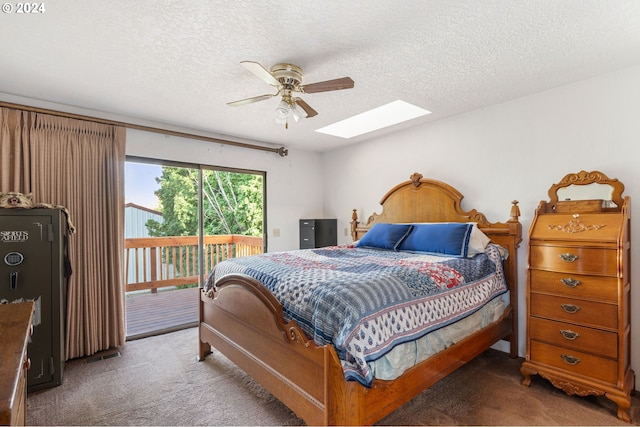 carpeted bedroom with ceiling fan, a skylight, access to outside, and a textured ceiling