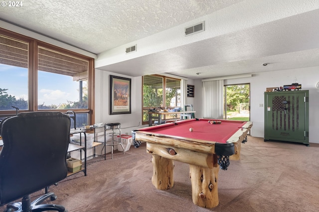 recreation room featuring pool table, carpet, and a textured ceiling