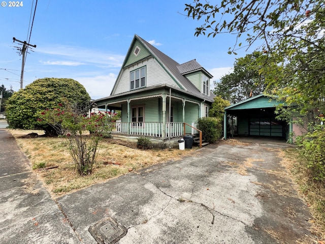 view of front of house featuring a carport and covered porch