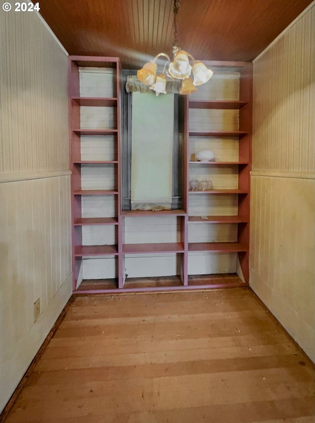 interior space featuring an inviting chandelier and light wood-type flooring