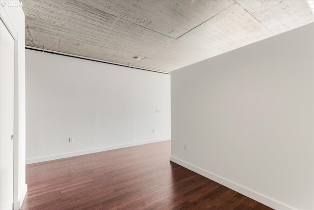 empty room featuring wood-type flooring