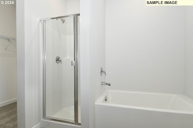 bathroom featuring plus walk in shower