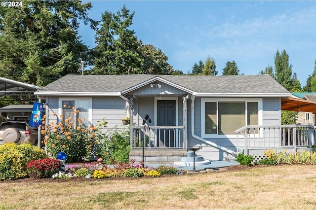 view of front of house with a porch and a front yard