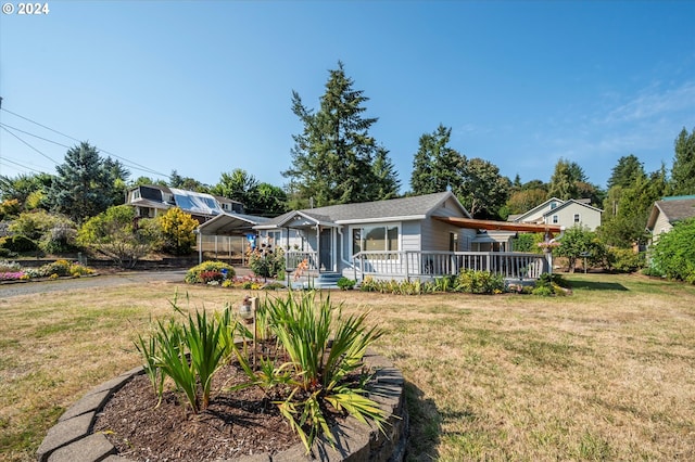 view of front of home with a front yard and a porch