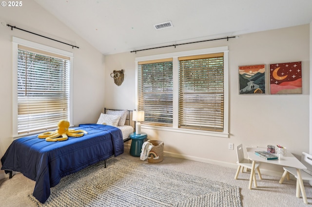 bedroom with multiple windows, carpet flooring, and vaulted ceiling