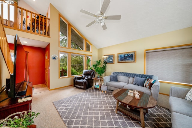 living room with carpet flooring, high vaulted ceiling, and ceiling fan