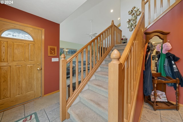 tiled foyer with ceiling fan