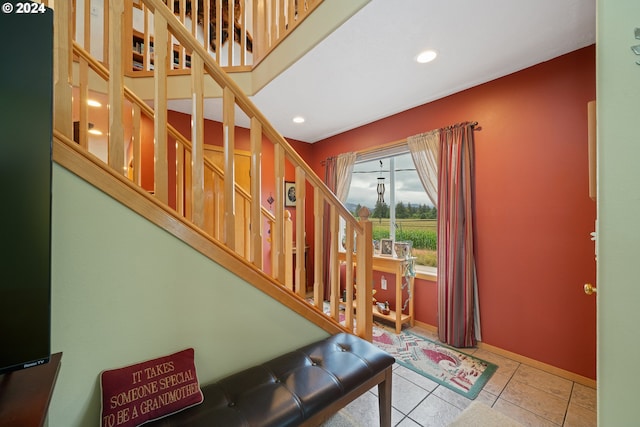 stairs featuring tile patterned floors