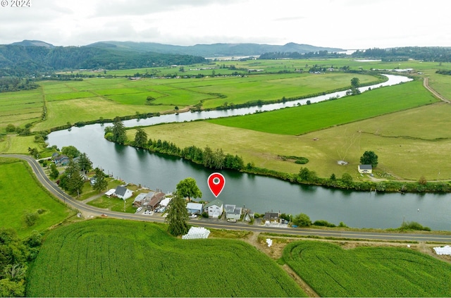 bird's eye view with a water and mountain view and a rural view