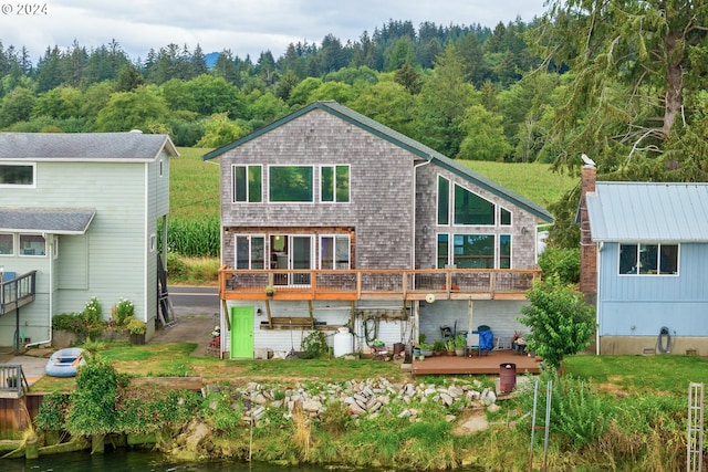 rear view of property with a wooden deck