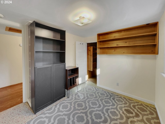 walk in closet featuring light hardwood / wood-style flooring