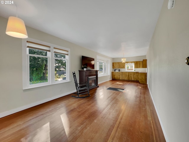 unfurnished living room featuring hardwood / wood-style floors