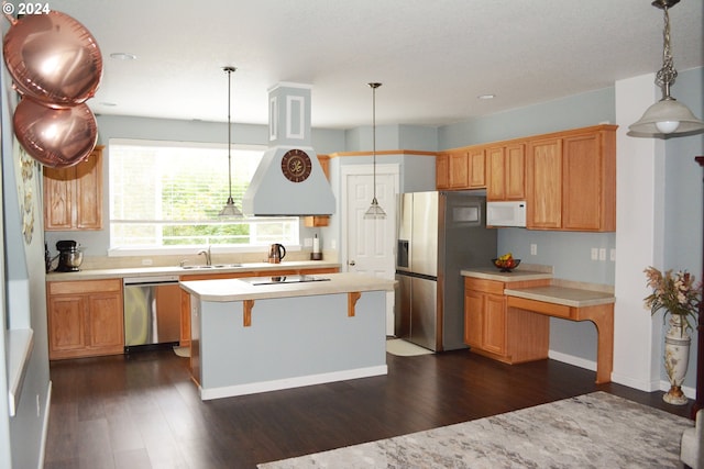 kitchen featuring stainless steel appliances, a sink, dark wood-style floors, light countertops, and recessed lighting
