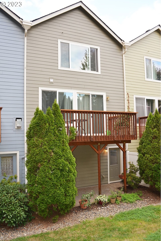 rear view of house with a wooden deck