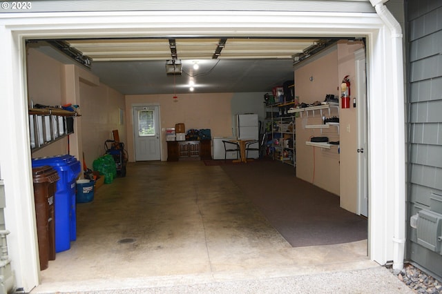 garage featuring a garage door opener