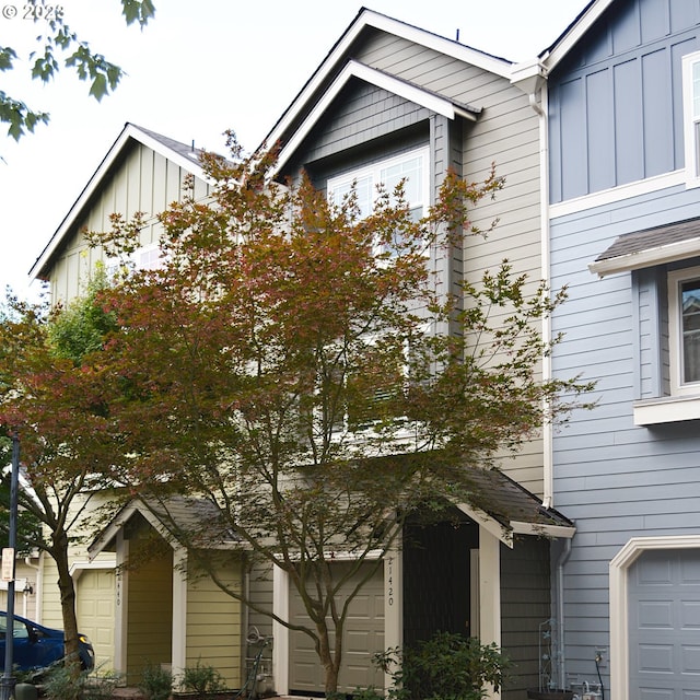view of front of home featuring board and batten siding and an attached garage